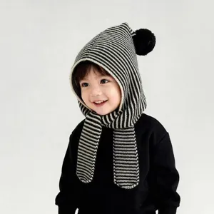 Black and white striped knit hooded scarf detail, cute kids winter warm accessory close up.