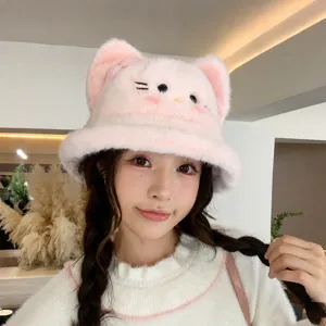 Close-up of the cute pink plush cat ear bucket hat worn by model, sweet Japanese winter style.