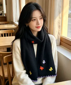 Black knitted winter scarf featuring colorful butterfly embroidery and warm cozy design.
