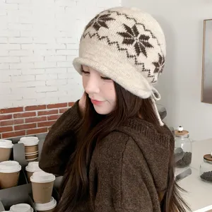 Detailed close-up view of the stylish women winter jacquard knit hat with rolled brim.