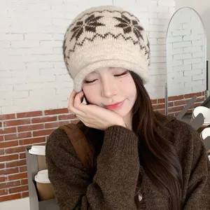 Cozy knit beanie with jacquard pattern and brim for women, warm winter thermal cap, stylish brown.