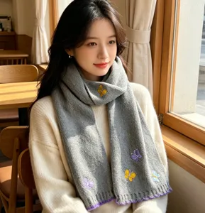 Grey knitted scarf for women with cute butterfly embroidery, warm winter neckwear accessory.