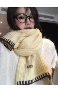 Cozy yellow knitted scarf with brown stripe edges, warm winter neck warmer for women.