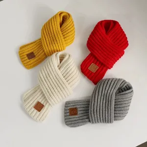 Children winter knitted warm scarf detail view showing four color options with leather patch.