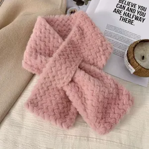 Plush winter cross scarf for women, soft pink fuzzy neck warmer, cozy cold weather accessory.