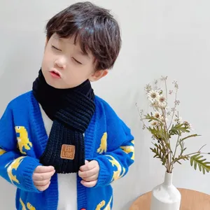 Kids warm black knit scarf with leather patch for winter, cozy toddler neck warmer accessory.