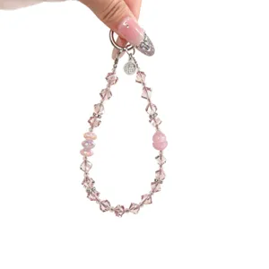 Pink crystal beaded phone chain and bag charm with cute gourd and lucky coin pendant.