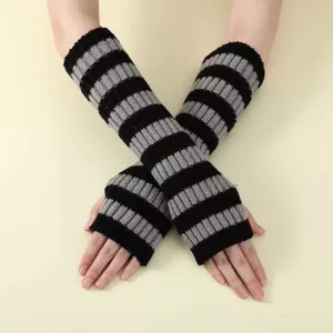 Detailed view of knitted striped fingerless gloves, cozy winter arm warmers for women.