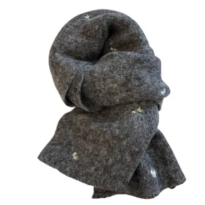 Grey knitted winter scarf with delicate little daisy embroidery for warm elegant style.