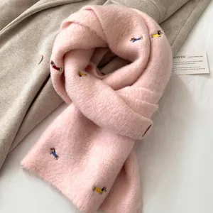 Cozy pink knitted winter scarf featuring cute dachshund embroidery, soft and warm neckerchief.