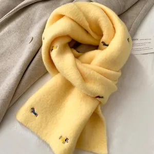 Cozy yellow knitted scarf featuring cute dachshund embroidery, soft winter warm neck wear.