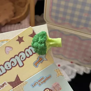 Close up detail of cute 3D broccoli duckbill hair clip, funny sweet vegetable hair accessory.