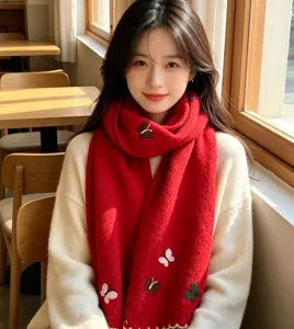 Cozy red knitted winter scarf for women featuring charming butterfly embroidery. Soft and warm.