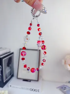 Exquisite red crystal beaded phone charm and sweet strawberry keychain for daily use.