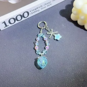 Detailed close-up of the cute crystal strawberry beaded keychain, featuring blue beads.