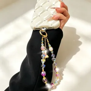 Crystal beaded phone charm detail, alloy butterfly and colorful crystal beads decoration.