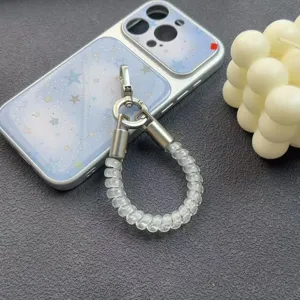 Close-up detail shot of transparent coiled phone lanyard strap featuring silver metal clasp.