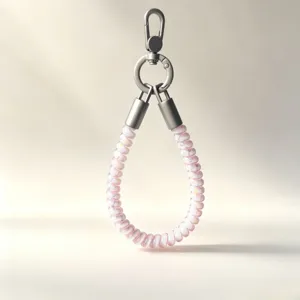 Detail shot of colorful TPU telephone cord wrist phone strap with durable metal clasp for secure hold.