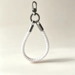 Detailed view of white telephone wire phone charm strap with sturdy metal clasp and hook.