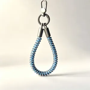 Close-up detail of blue coiled phone wrist strap featuring sturdy metal clasp and hardware.