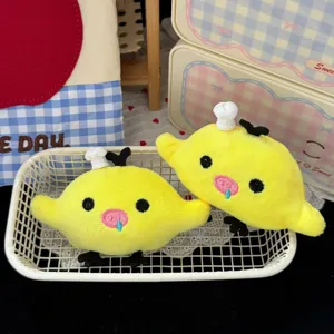 Cute plush yellow duck hair clip detail shot, funny chef hat design, soft fabric hair accessory.