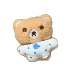 Simpatico ciondolo in peluche di orsetto marrone con bavaglino a pois per decorazione zaino.