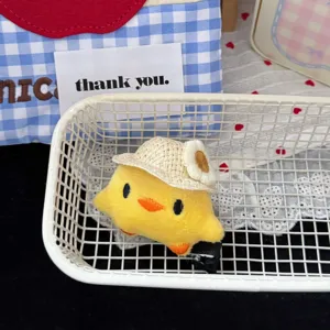 Cute plush yellow duck hair clip with straw hat, sweet girlish hair accessory for daily wear.