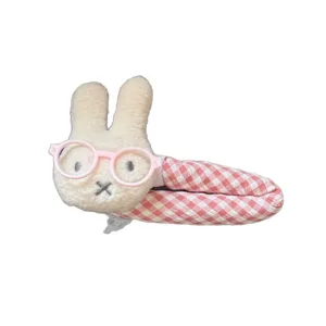 Cute pink bunny plush hair clip with sweet gingham plaid design for girls and kids fashion styling.