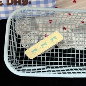Cute dopamine style polka dot bow hair clip, sweet Korean girl hair accessory detail shot.