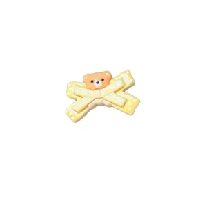 Cute yellow polka dot bow hair clip with sweet cartoon bear design for girls hair accessories.