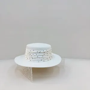 Korean style white straw boater hat with chic polka dot ribbon for women summer beach travel.