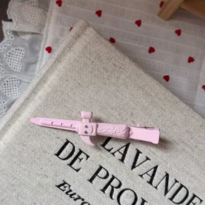 Pink rhinestone shovel hair clip detail view, sweet girlish duckbill hairpin accessory.