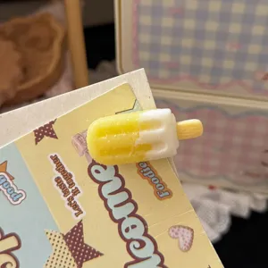 Close-up detail shot of the sweet candy-colored ice cream hair clip, cute daily accessory.