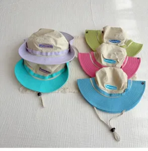 Detailed view of 2026 spring summer outdoor color block quick dry sun protection bucket hat family.