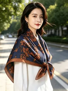 Detailed view of women's dark blue floral velvet square scarf, elegant floral pattern shawl.