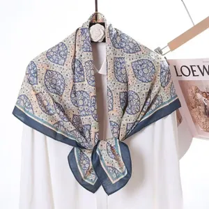Exquisite vintage printed square scarf detail, elegant blue and white pattern silk velvet fabric.