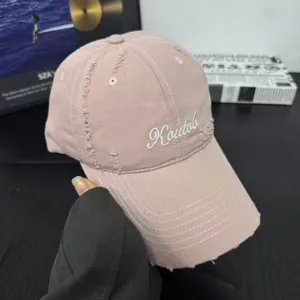 Distressed cotton baseball cap with embroidered logo, soft crown and curved brim for men and women.
