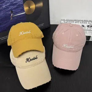 Distressed cotton baseball cap for women and men, stylish curved brim, casual hat.