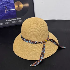 Women summer straw sun hat with stylish geometric printed ribbon and beaded wide brim beach hat.