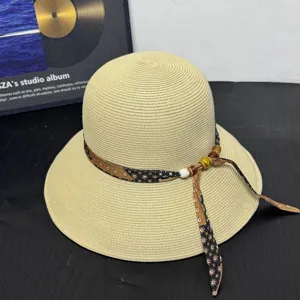 Summer women straw sun hat with floral ribbon and wooden bead decoration for beach outdoor travel.