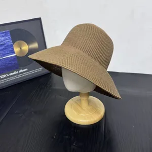 Summer woven straw sun hat with wide brim for women, stylish casual beach vacation sunshade hat.