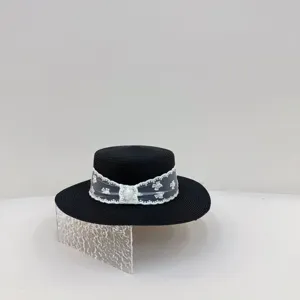 French style black straw boater hat with white lace ribbon and floral embellishment for women.
