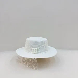 French white flat top straw hat with delicate lace band, perfect for summer vacation and beach.