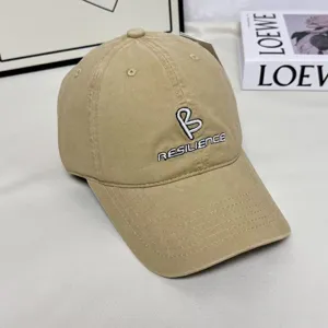 Khaki baseball cap with stylish B embroidery and resilience text, perfect for casual wear.