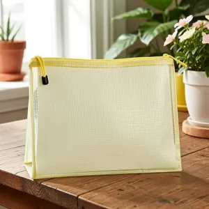 Transparent mesh file bag detail, light yellow zipper stationery pouch for office storage.