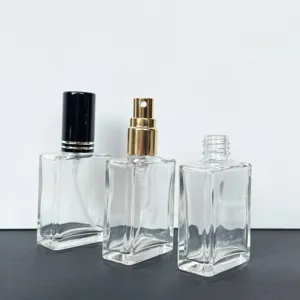 Clear 15ml glass perfume sample bottles featuring spray nozzles and caps for portable travel use.