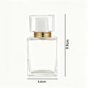 Detailed view of the 30ml square clear glass refillable perfume bottle with gold collar.