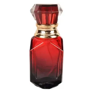 Parfümflakon Detailansicht mit rot-schwarzem Farbverlauf, Goldkragen und Diamantkappe.