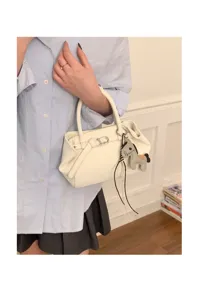 Minimalist white leather handbag for women, chic crossbody tote with cute horse charm.