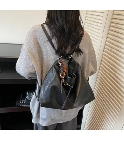 Detailed view of the casual black convertible shoulder and backpack with multi-functional design.